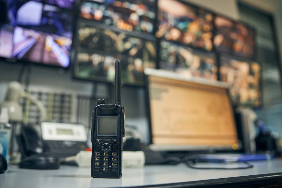 Walkie talkie placed on an office desk in a contro 2026 03 10 02 09 28 utc